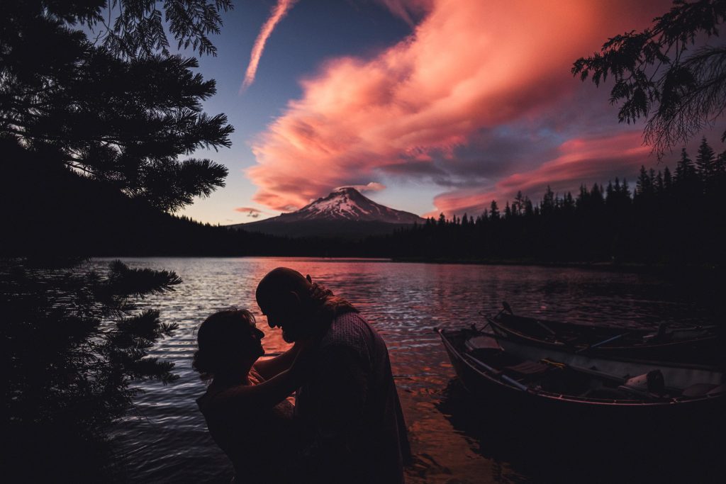 Sunset and silhouette of an engaged couple taking Trillium Lake Engagement Photos